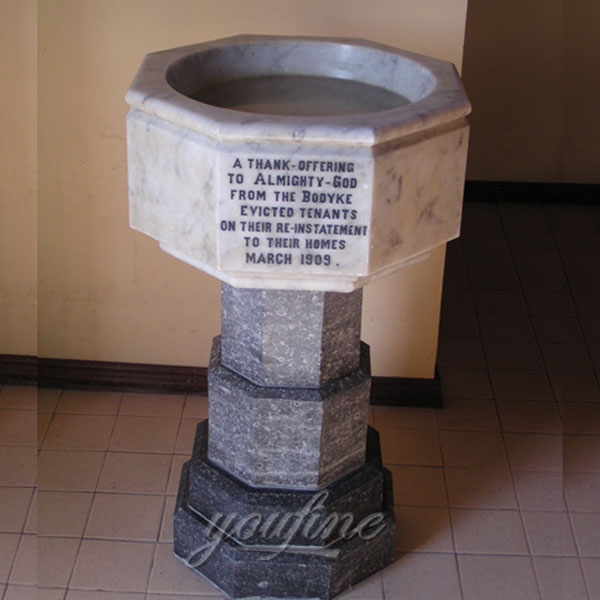 Church interior decor of marble holy water font