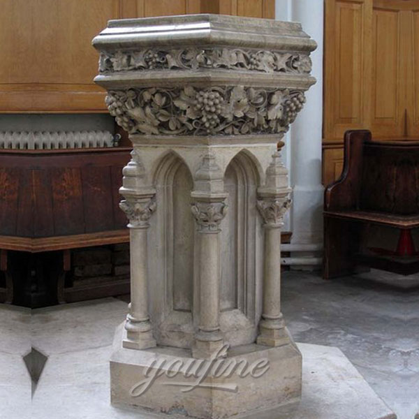 Religious statues of beautiful antique marble altar with grape and columns decor